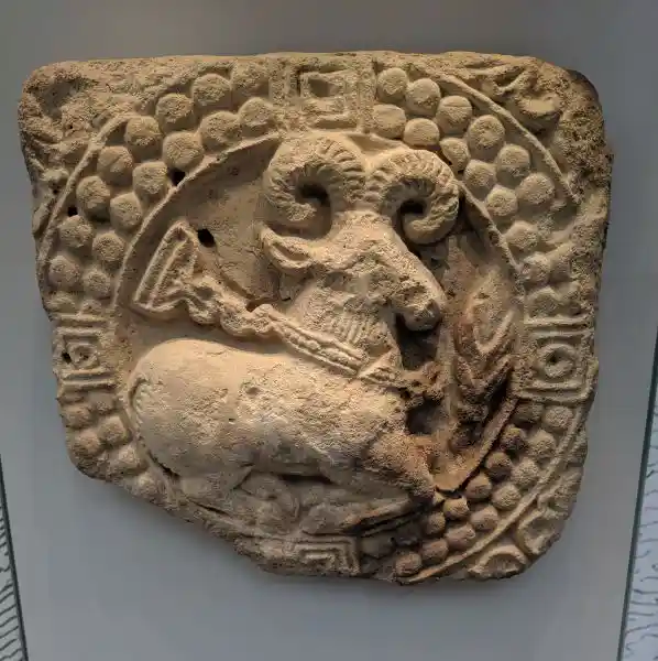 One of the Sasanian stucco art collections, ram inside solar disc, four-point cross, located at the Pergamon museum.